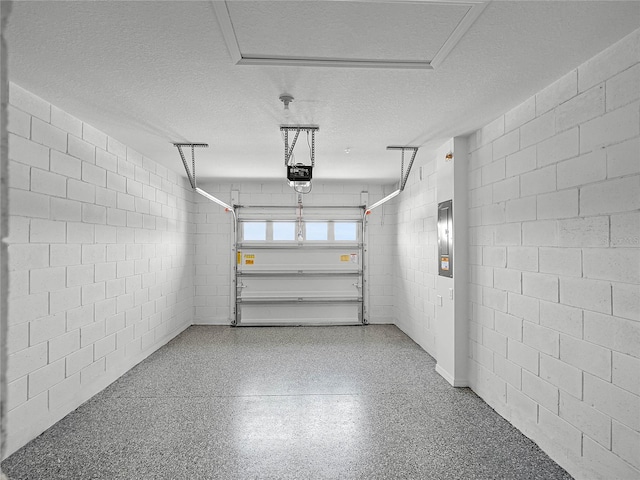 1562 Dalehurst Ln, Kissimmee, FL 34744 - garage featuring a garage door opener and concrete block wall