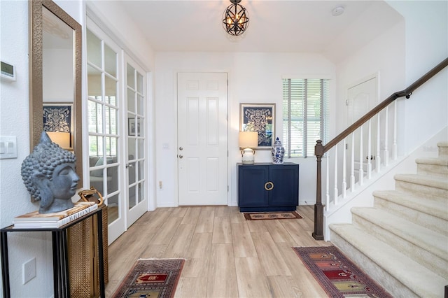 6543 Orange Cream Aly, Winter Garden, FL 34787 - foyer featuring light wood-style floors, stairway, and baseboards