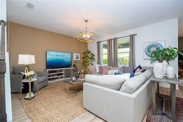 6543 Orange Cream Aly, Winter Garden, FL 34787 - living area featuring light wood-type flooring and a chandelier
