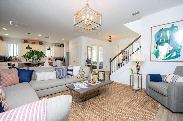 6543 Orange Cream Aly, Winter Garden, FL 34787 - living room with a chandelier, stairway, recessed lighting, and light colored carpet