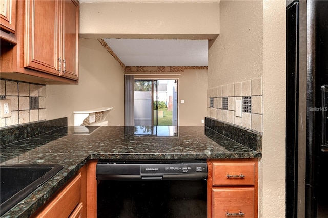 738 Haven Pl, Tarpon Springs, FL 34689 - kitchen featuring black appliances, brown cabinets, decorative backsplash, a peninsula, and dark stone counters
