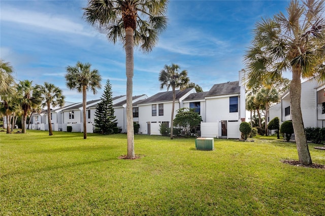 738 Haven Pl, Tarpon Springs, FL 34689 - view of green lawn featuring a residential view