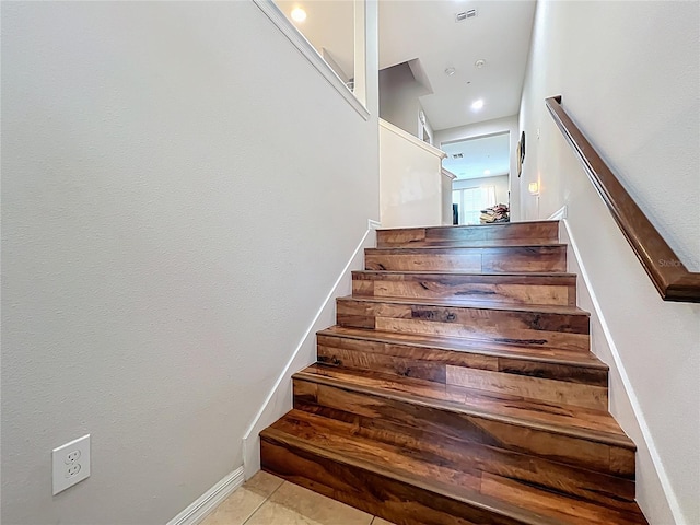 1027 Cedar Bay Ln, Winter Springs, FL 32708 - stairway featuring tile patterned floors and baseboards