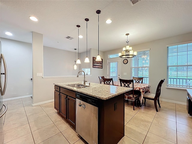 1027 Cedar Bay Ln, Winter Springs, FL 32708 - kitchen featuring a sink, dishwasher, light tile patterned flooring, light stone counters, and baseboards