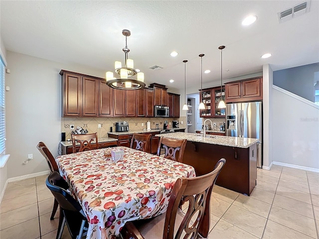 1027 Cedar Bay Ln, Winter Springs, FL 32708 - dining space featuring a chandelier, light tile patterned floors, baseboards, and recessed lighting