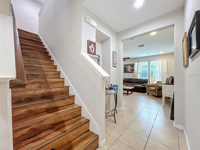 1027 Cedar Bay Ln, Winter Springs, FL 32708 - staircase with tile patterned flooring and baseboards