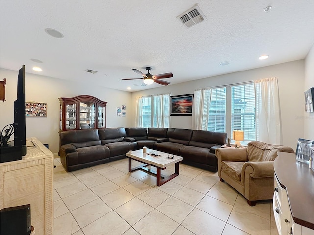 1027 Cedar Bay Ln, Winter Springs, FL 32708 - living room featuring light tile patterned floors, a ceiling fan, recessed lighting, and a textured ceiling
