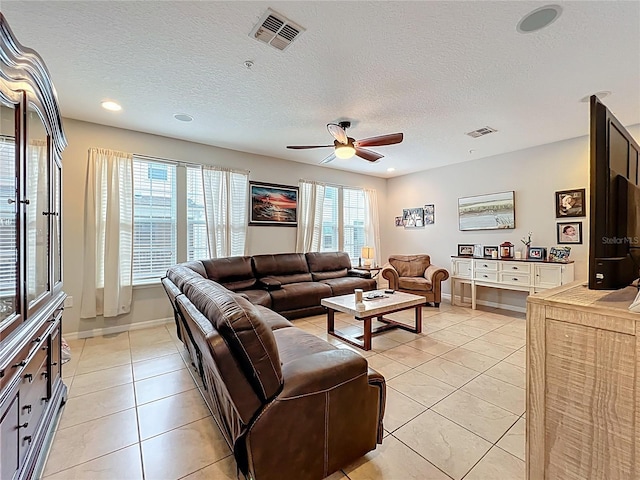 1027 Cedar Bay Ln, Winter Springs, FL 32708 - living room with ceiling fan, light tile patterned floors, a textured ceiling, baseboards, and recessed lighting