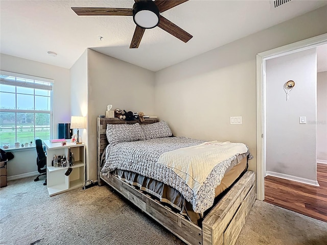 1027 Cedar Bay Ln, Winter Springs, FL 32708 - carpeted bedroom with baseboards, a ceiling fan, and an office area