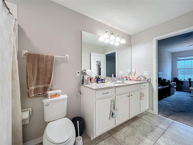 1027 Cedar Bay Ln, Winter Springs, FL 32708 - full bath featuring toilet, vanity, and a textured ceiling