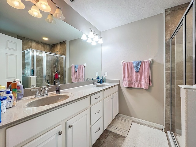 1027 Cedar Bay Ln, Winter Springs, FL 32708 - full bath featuring a shower stall, double vanity, tile patterned flooring, a textured ceiling, and baseboards