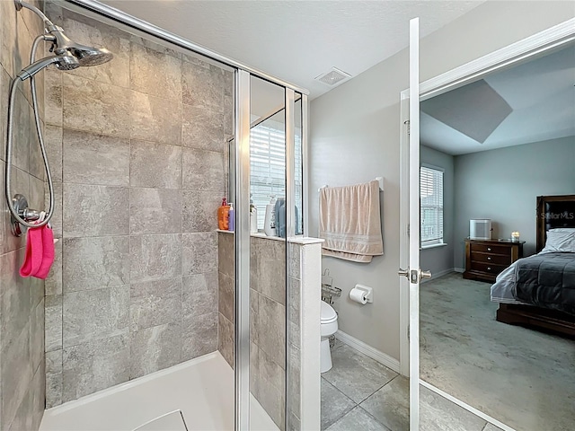 1027 Cedar Bay Ln, Winter Springs, FL 32708 - bathroom with a shower stall, baseboards, and toilet