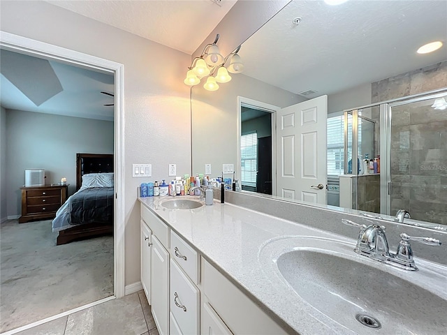 1027 Cedar Bay Ln, Winter Springs, FL 32708 - ensuite bathroom with a shower stall, double vanity, and baseboards