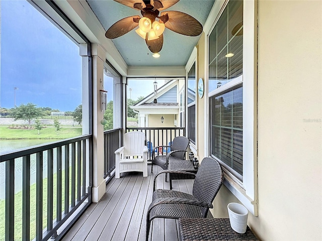 1027 Cedar Bay Ln, Winter Springs, FL 32708 - sunroom / solarium featuring a ceiling fan and a water view