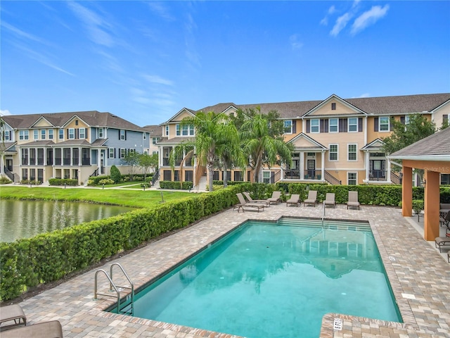 1027 Cedar Bay Ln, Winter Springs, FL 32708 - community pool featuring a patio, a residential view, and a water view