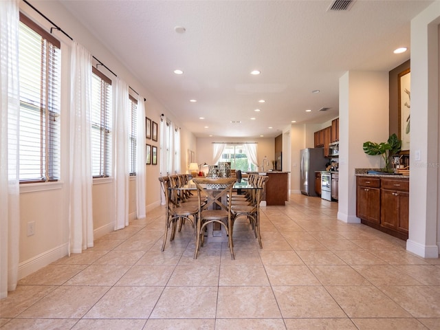 311 W Falls Dr, Kissimmee, FL 34747 - dining space featuring recessed lighting and light tile patterned floors