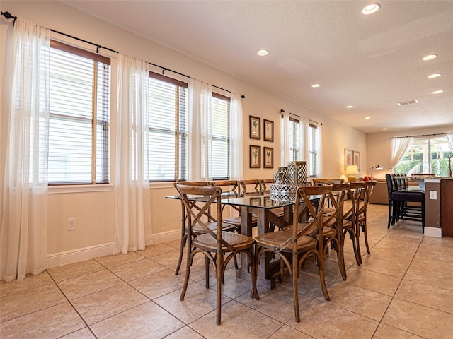311 W Falls Dr, Kissimmee, FL 34747 - dining room featuring light tile patterned floors, recessed lighting, baseboards, and a textured ceiling
