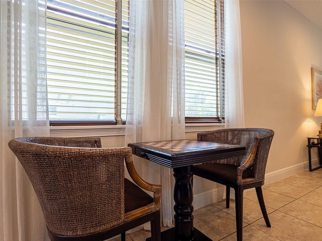 311 W Falls Dr, Kissimmee, FL 34747 - tiled dining area featuring plenty of natural light and baseboards