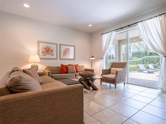 311 W Falls Dr, Kissimmee, FL 34747 - living room featuring light tile patterned floors, recessed lighting, and a textured ceiling