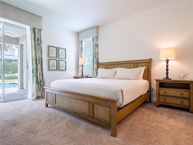 311 W Falls Dr, Kissimmee, FL 34747 - carpeted bedroom with access to outside and multiple windows
