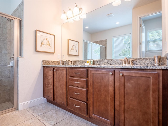 311 W Falls Dr, Kissimmee, FL 34747 - full bathroom with a stall shower, double vanity, tile patterned floors, and baseboards