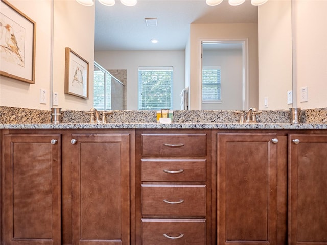 311 W Falls Dr, Kissimmee, FL 34747 - bathroom featuring a shower stall and double vanity