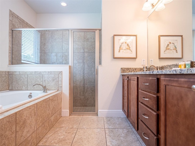 311 W Falls Dr, Kissimmee, FL 34747 - full bathroom with a shower stall, a garden tub, vanity, and tile patterned floors
