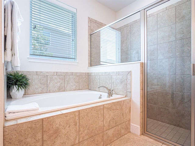 311 W Falls Dr, Kissimmee, FL 34747 - bathroom featuring a stall shower, a garden tub, and tile patterned floors