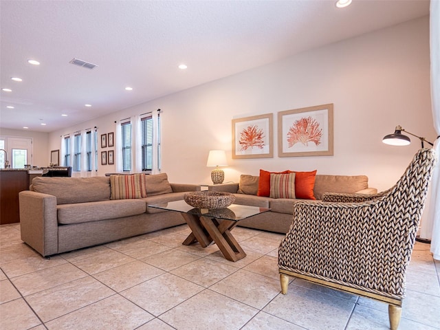 311 W Falls Dr, Kissimmee, FL 34747 - living room with recessed lighting and light tile patterned floors