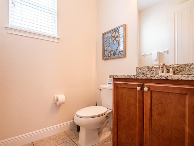 311 W Falls Dr, Kissimmee, FL 34747 - bathroom with tile patterned floors, toilet, baseboards, and vanity
