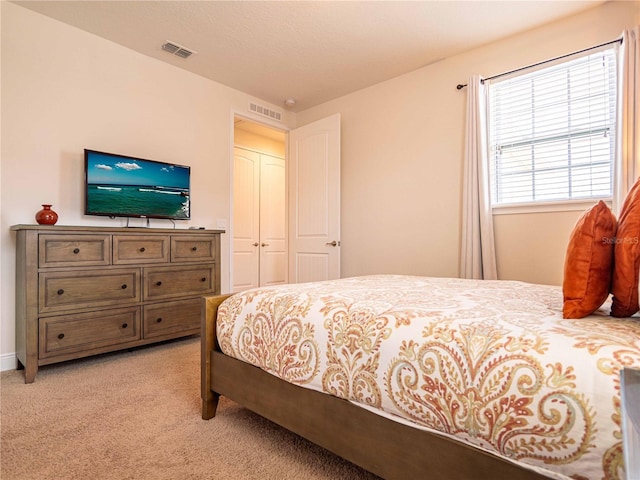 311 W Falls Dr, Kissimmee, FL 34747 - bedroom with light carpet and baseboards