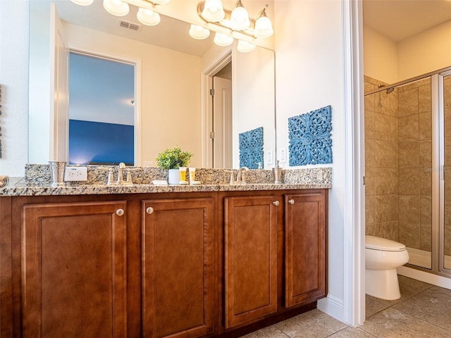 311 W Falls Dr, Kissimmee, FL 34747 - full bathroom featuring a stall shower, tile patterned floors, toilet, and double vanity