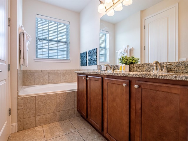 311 W Falls Dr, Kissimmee, FL 34747 - full bath featuring tile patterned flooring, a chandelier, a garden tub, and double vanity