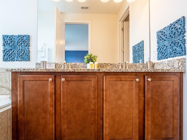 311 W Falls Dr, Kissimmee, FL 34747 - bathroom with a bathtub and double vanity