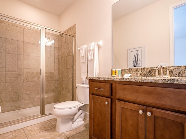 311 W Falls Dr, Kissimmee, FL 34747 - bathroom featuring toilet, a stall shower, vanity, and tile patterned flooring