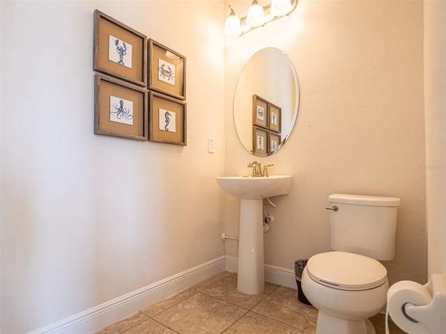 311 W Falls Dr, Kissimmee, FL 34747 - half bathroom featuring toilet, tile patterned flooring, and baseboards