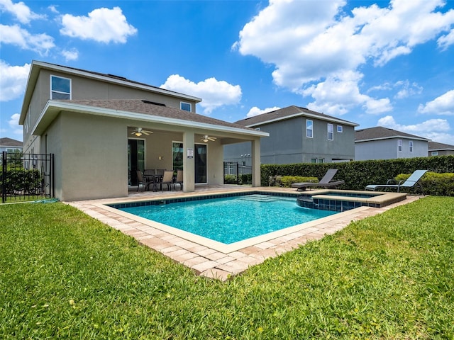 311 W Falls Dr, Kissimmee, FL 34747 - view of swimming pool with a ceiling fan, a patio area, and a pool with connected hot tub