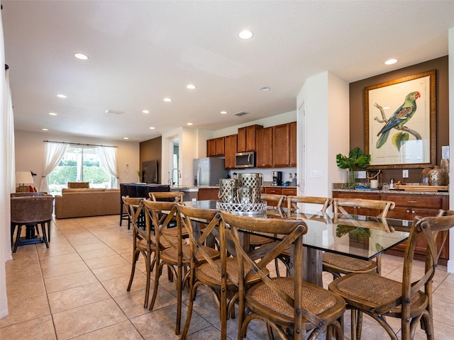 311 W Falls Dr, Kissimmee, FL 34747 - dining room with recessed lighting and light tile patterned floors