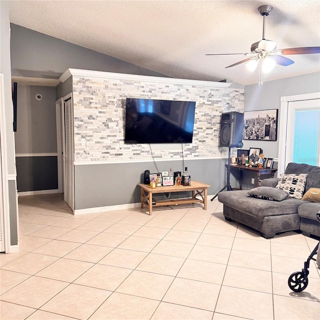 4235 Shades Crest Ln, Sanford, FL 32773 - living area with ceiling fan, a textured ceiling, light tile patterned flooring, and lofted ceiling