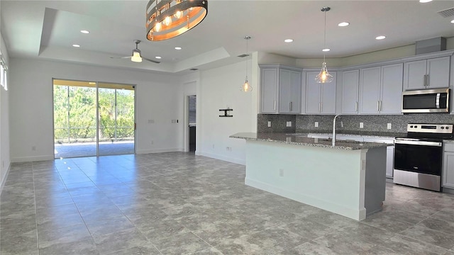 726 Coral Reef Way, Daytona Beach, FL 32124 - kitchen featuring stainless steel appliances, backsplash, stone countertops, baseboards, and recessed lighting