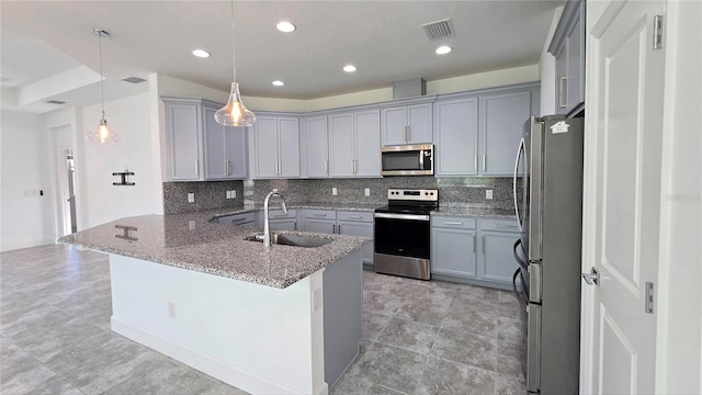 726 Coral Reef Way, Daytona Beach, FL 32124 - kitchen with stainless steel appliances, a sink, gray cabinets, tasteful backsplash, and recessed lighting