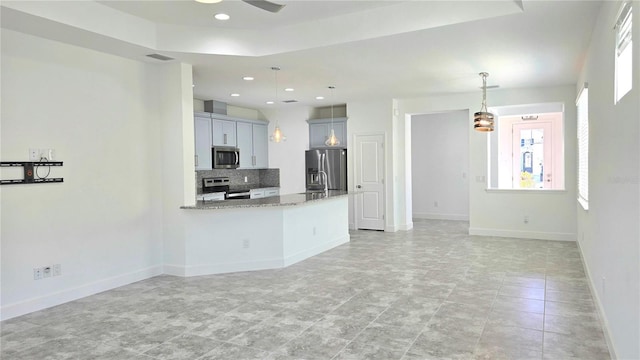 726 Coral Reef Way, Daytona Beach, FL 32124 - unfurnished living room with a ceiling fan, baseboards, and recessed lighting