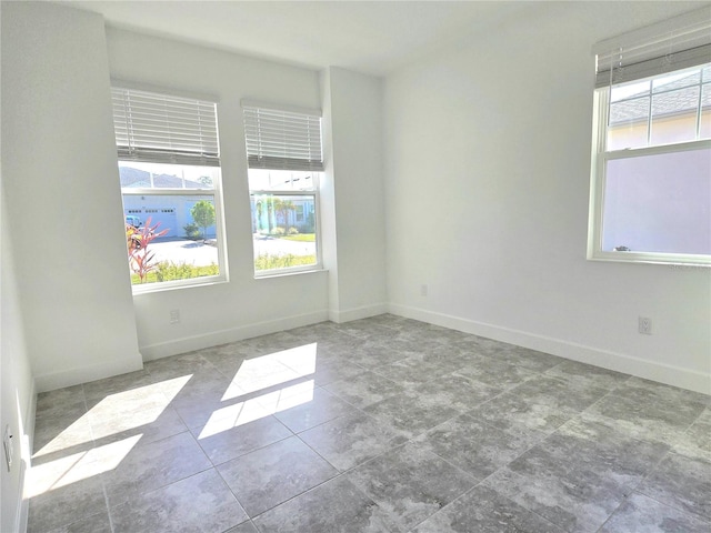 726 Coral Reef Way, Daytona Beach, FL 32124 - spare room with plenty of natural light and baseboards
