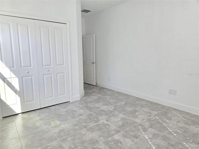 726 Coral Reef Way, Daytona Beach, FL 32124 - unfurnished bedroom with a closet and baseboards