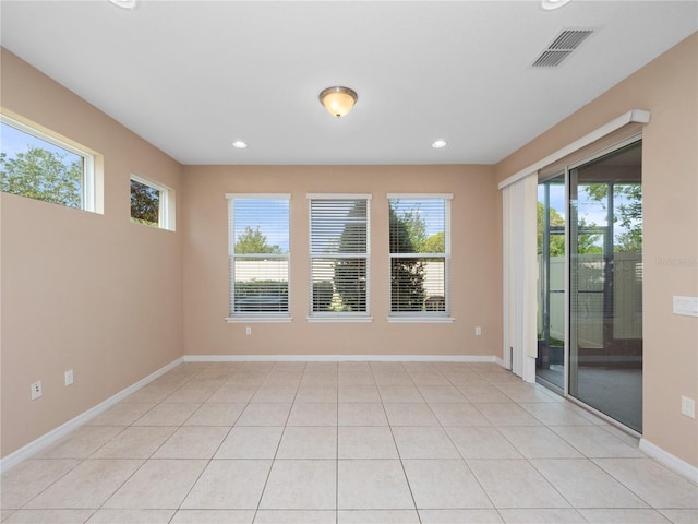 unfurnished room featuring recessed lighting and baseboards