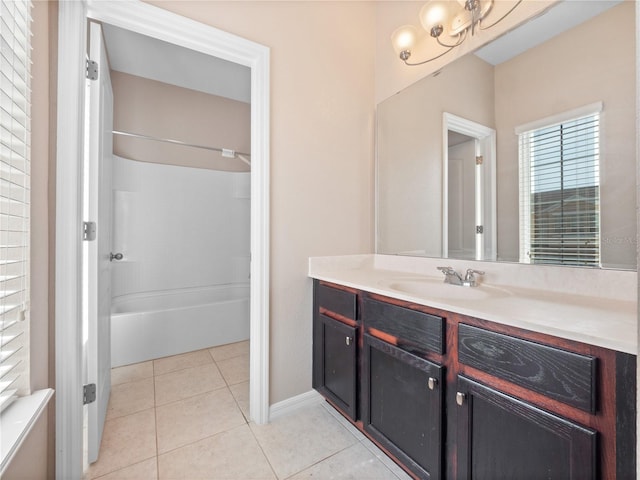 bathroom with vanity, tile patterned flooring, shower / bath combination, and baseboards