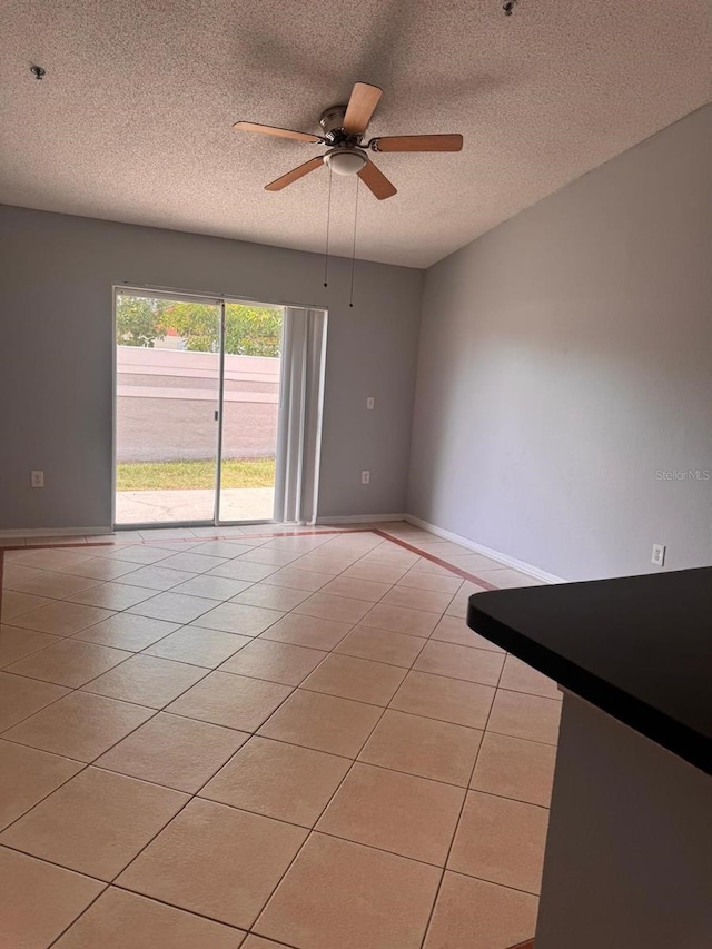 1603 Emily Ct, Kissimmee, FL 34744 - unfurnished room featuring light tile patterned floors, a ceiling fan, and a textured ceiling