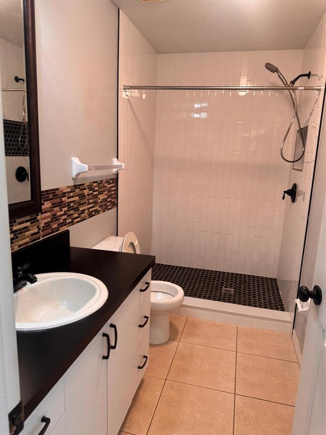 1603 Emily Ct, Kissimmee, FL 34744 - full bath featuring vanity, tile patterned floors, a stall shower, and tasteful backsplash