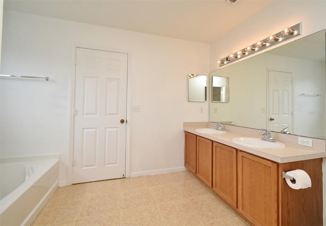 115 Bristol Forest Trl, Sanford, FL 32771 - full bath with tile patterned floors, a bath, double vanity, and baseboards