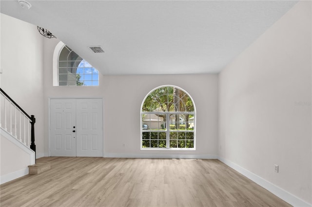 12917 Grovehurst Ave, Winter Garden, FL 34787 - entryway with wood finished floors, healthy amount of natural light, and baseboards